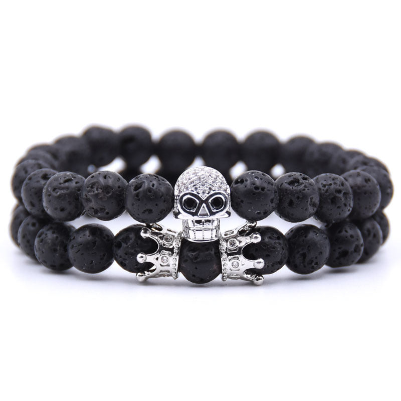 Armband Konstellation aus Vulkangestein mit Totenkopf und Kronen